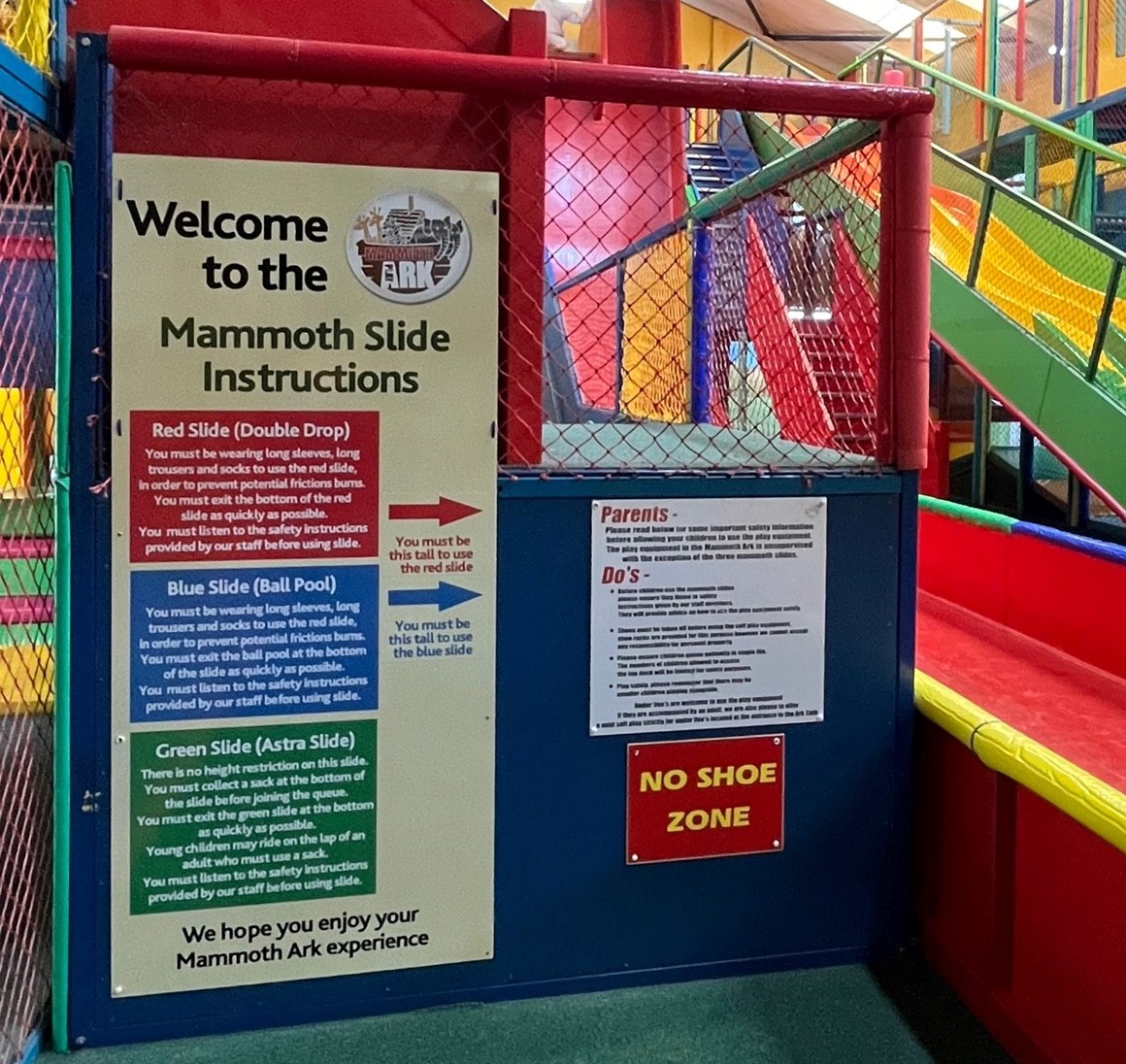 Welcome to the Mammoth Slide signage 'You must be this tall to ride'