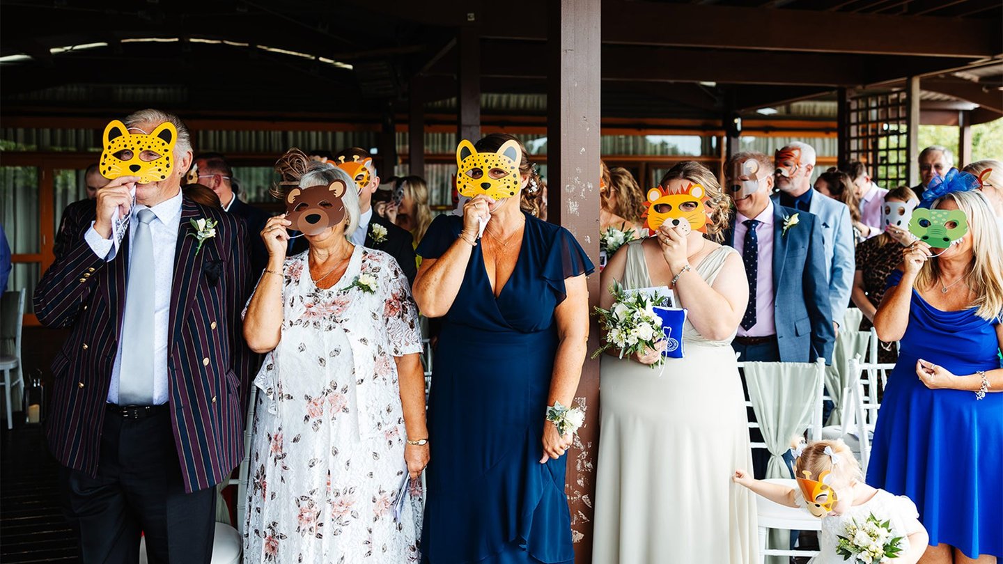 Image of wedding guests with animal masks web res landscape 1920x1080