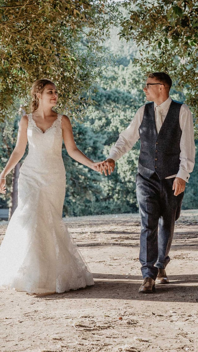 Image of couple walking through trees mob portrait 1080x1920 final