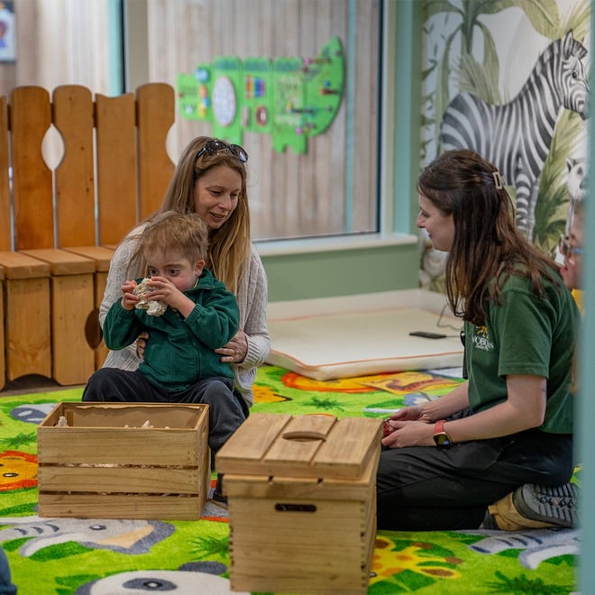 Image of tash and child in play area 1080x1080n web