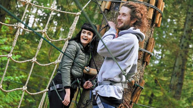 Image of two people on treetop challenge web landscape 1920x1080