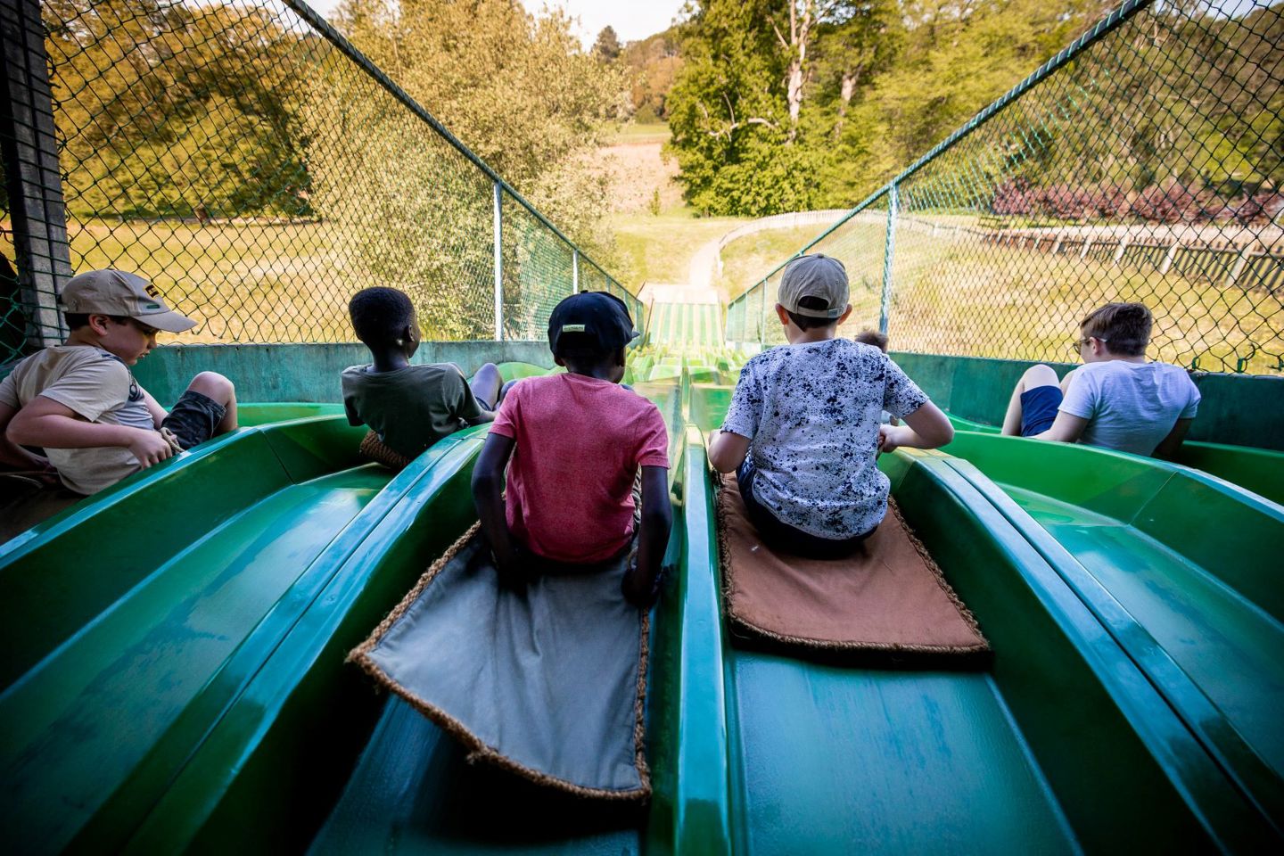 Five children wait to slide down Bobcat Run slide